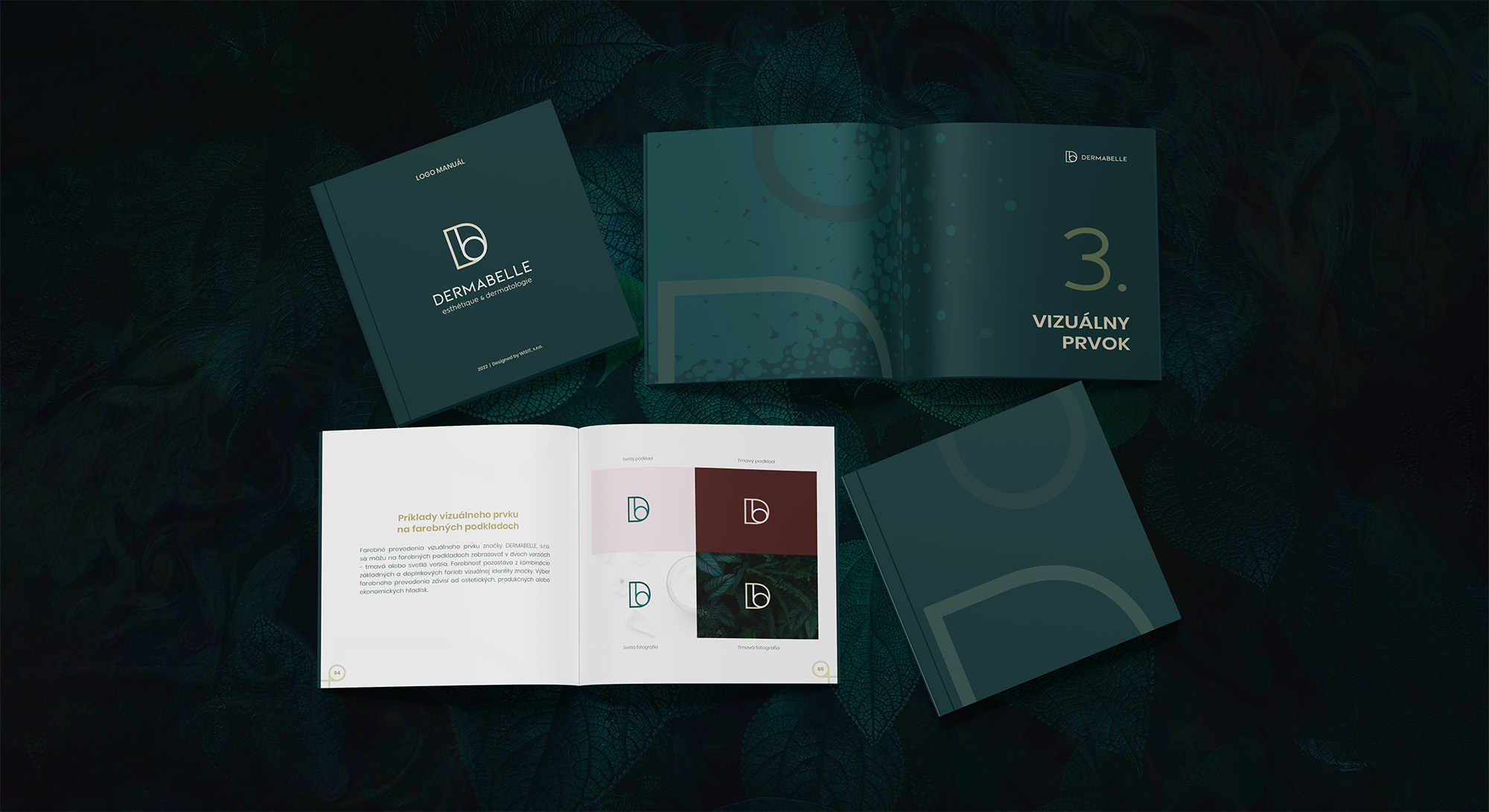 The DERMABELLE logo manual spread out on dark leaves