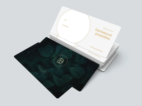 DERMABELLE gift cards stacked on a grey background